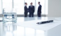 Pen on document and glass of water